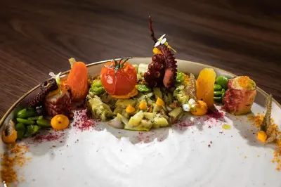 a plate of food on a wooden table at Gostišče Iršič in Slovenska Bistrica