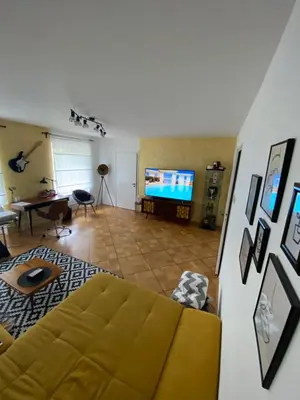 a living room with a couch and a flat screen tv at Apartma center in Rogaška Slatina