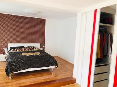a bedroom with a bed and a closet at Apartma center in Rogaška Slatina