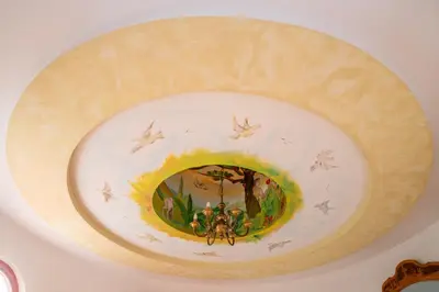a plate with a painting of two bees on it at Winery Toplak in Juršinci