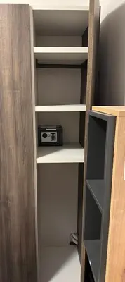 a book shelf with a radio on it at RailwayRooms22 in Ljubljana