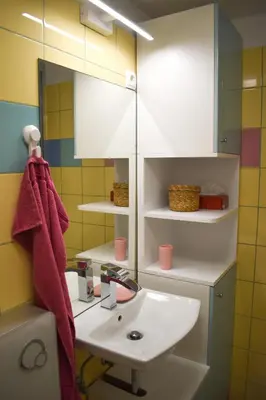 a bathroom with a sink and a mirror at Apartment River Ljubljanica in Ljubljana