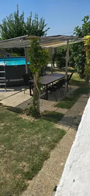 a picnic table under a pavilion in a park at Kajžarka in Miklavž pri Ormožu