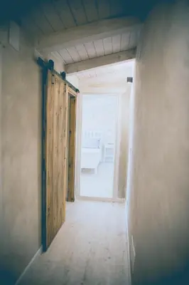 an empty room with an open door and a hallway at Lavandula House in Štanjel