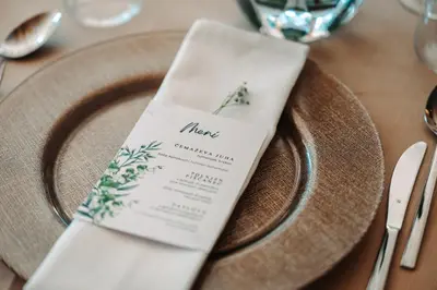a napkin sitting on a plate on a table at Jakobs Lodge in Zgornje Gorje
