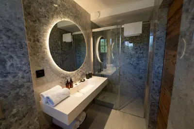 a bathroom with a sink and a mirror at Jakobs Lodge in Zgornje Gorje