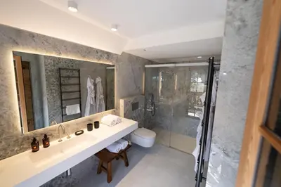 a bathroom with a sink and a shower at Jakobs Lodge in Zgornje Gorje