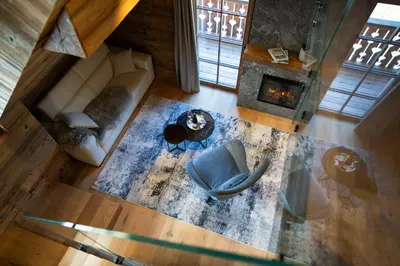 an overhead view of a living room with a couch and a fireplace at Jakobs Lodge in Zgornje Gorje
