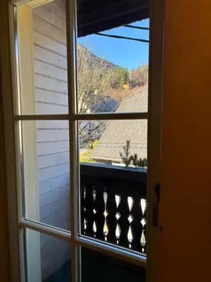 an open window with a view of a roof at Pod Gora Boutique Hotel in Kranjska Gora