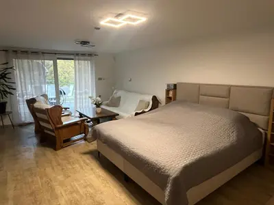 a bedroom with a bed and a table and chairs at Prista Ranch Cirkulane in Rove