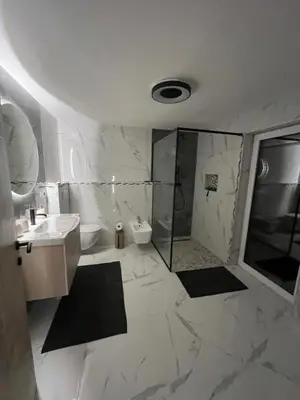 a bathroom with a shower and a toilet and a sink at Prista Ranch Cirkulane in Rove