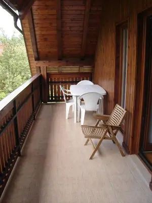 a balcony with a table and chairs on it at Apartment Veduta in Bovec