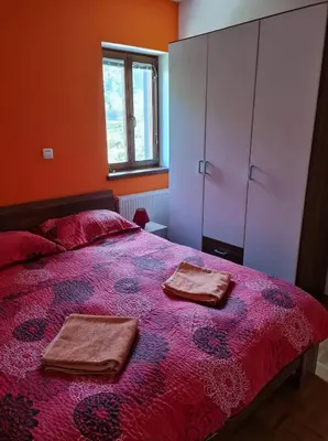 a bedroom with a bed with two towels on it at Apartment Veduta in Bovec