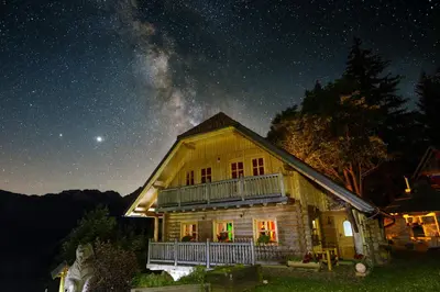 a cabin under a starry sky at night at Holiday chalet 
