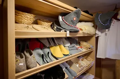 a closet filled with lots of shoes and hats at Holiday chalet 