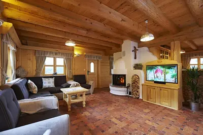 a living room with a couch and a tv at Holiday chalet 