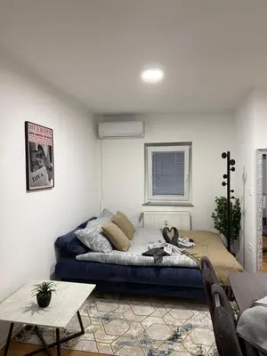 a room with a bed and a table in it at Apartmaji MAS 1 in Ljubljana