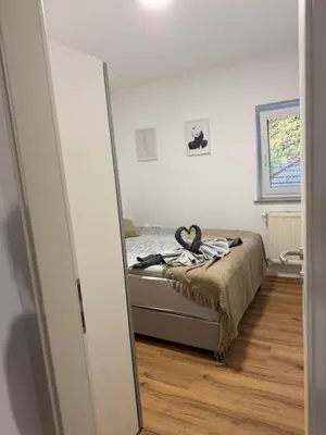 a bedroom with a bed and a mirror at Apartmaji MAS 1 in Ljubljana