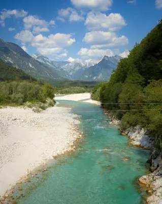 a view of a river with mountains in the background at Family Apartment Bovec in Bovec