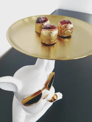 a table with a plate of donuts on it at Apartments Ana in Maribor