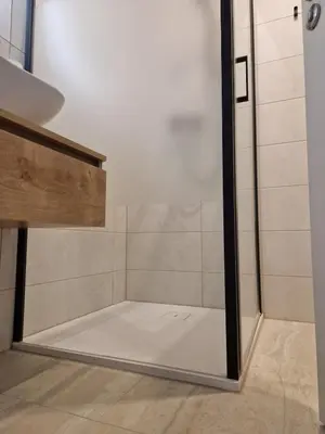 a shower with a glass door in a bathroom at Apartments Ana in Maribor