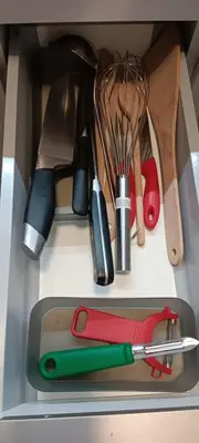 a drawer filled with lots of kitchen utensils at Studio apartma Rimljanka in Ptuj