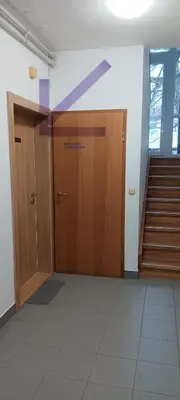 an empty hallway with a door and stairs at Studio apartma Rimljanka in Ptuj
