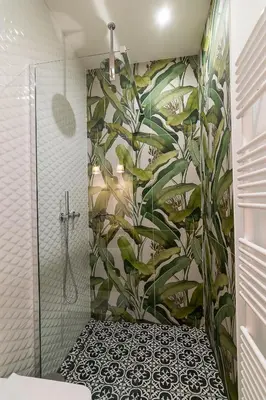 a bathroom with a shower with a large plant wall at Beatrice - Boutique Apartments Resort in Ljubljana