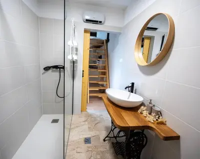 a bathroom with a sink and a mirror at Horse Whispering Ranch apartma in Ilirska Bistrica