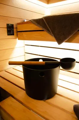 a black pot sitting on a table with a light at Oaza Luxury Glamping Resort in Moravske Toplice