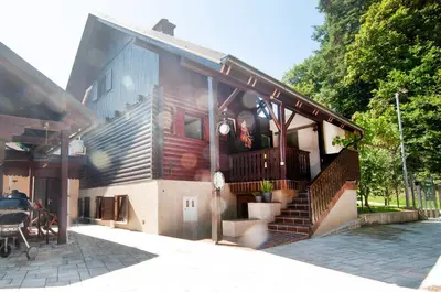 a house with a staircase on the side of it at Grunthouse in Prebold