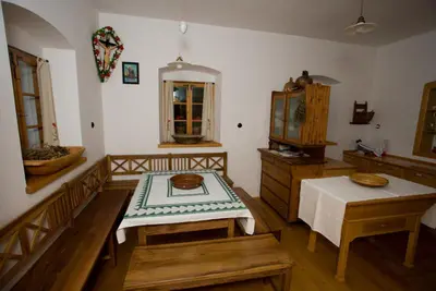 a living room with a table and a table sidx sidx sidx sidx at Farm Soržev mlin in Nova Cerkev