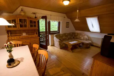 a living room with a couch and a table at Farm Soržev mlin in Nova Cerkev