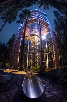 a glass building with a bell in front of it at APARTMA ARNIKA Rogla, Turistično naselje NUNE RESNIK, RESNIK 110 in Zreče