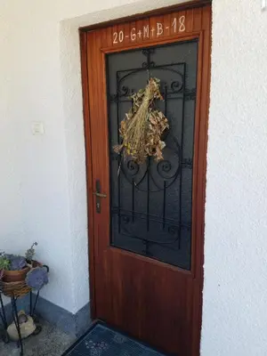 a wooden door with a sign on it at Apartma Raft, Bovec in Bovec