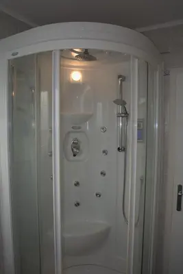 a bathroom with a shower and a sink at Apartment Golovec in Ljubljana