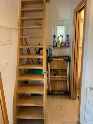 a set of stairs leading to a pantry at Holiday Home Lemut in Kranj