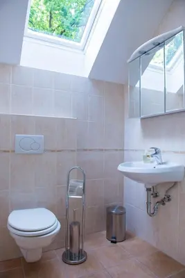 a bathroom with a toilet and a sink at Holiday Home Lemut in Kranj