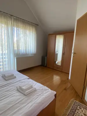 a bedroom with a bed with two white towels on it at Holiday Home Lemut in Kranj