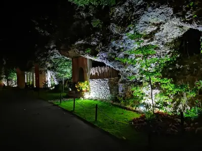 a building lit up at night at PR`FIK Apartments in Kranj
