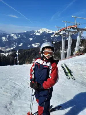 a person on skis standing on a ski lift at Apartment Tarman in Jesenice