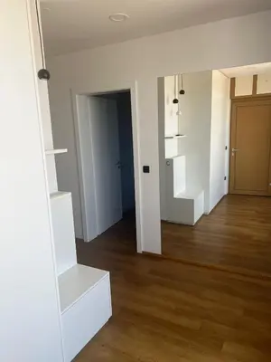 an empty room with white walls and wooden floors at Stunning Terrace in Ljubljana