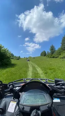 a view of a field from the back of a motorcycle at Cosy house Na Robu in Grgar