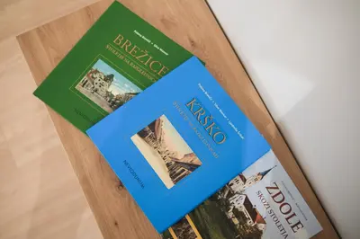 two books sitting on top of a book shelf at Apartma Ana in Krško