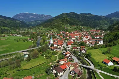 an aerial view of a small town in the mountains at House Planinka in the heart of nature in Ljubno