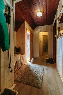 an empty room with a bed and a window at Chalet Tisa Velika Planina in Stahovica