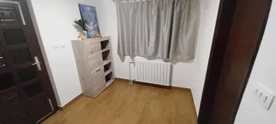 a room with a dresser and a window at KaTi Hiša