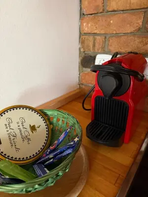 a basket of utensils on a table next to a mortar and pestle at Ekoviki in Kranj