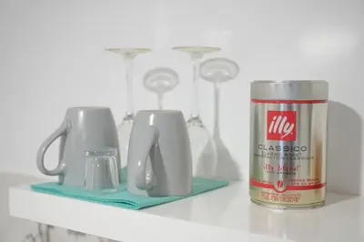 a shelf with a can of milk and appliances on it at Rooms Nonna Bled in Bled