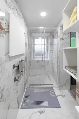 a bathroom with a shower with a glass door at Rooms Nonna Bled in Bled